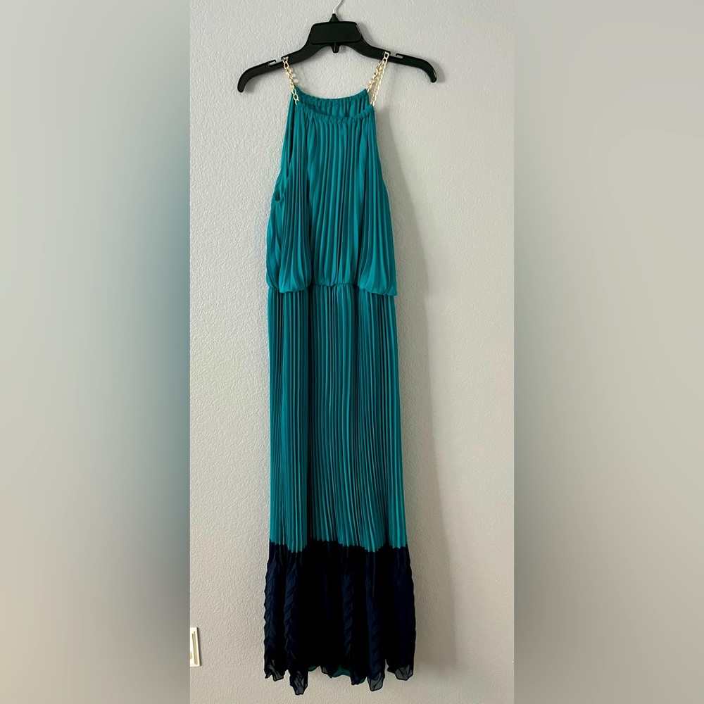 Pleated dress with chain straps.